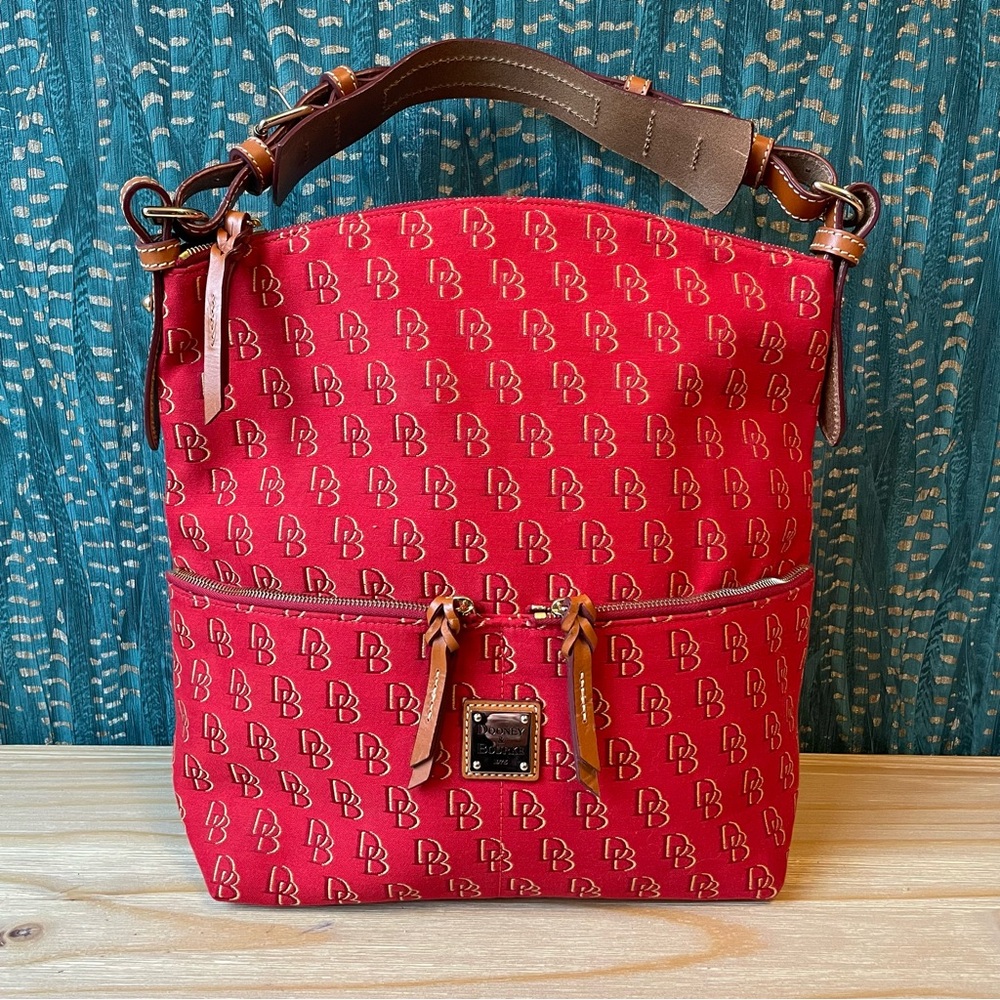 NWOT red Signature cloth Dooney & Bourke bag.